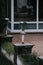 Vertical shot of street lamps and flowerpots with green plants