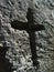 Vertical shot of the symbol of holy cross engraved in rock in Malta