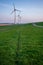 Vertical shot of tall wind-turbines along the Westermeerdijk in the Netherlands