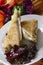 Vertical shot of tasty chicken and cheese club sandwiches on a white plate