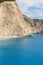 Vertical shot of the tents and the turquoise water of the Porto Katsiki Beach in Lefkada, Greece