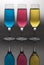 Vertical shot of three champagne flute glass with colorful liquids