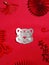 Vertical shot of the tiger metal decoration on the red Chinese background