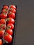 Vertical shot of tomatoes on wood - ecologic concept