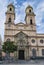 Vertical shot of the towers and facade of the San Antonio parish in Cadiz