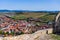 Vertical shot of town center with buildings, streets, and vegetation in Rupea, Romania