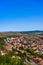 Vertical shot of town center with buildings, streets, and vegetation in Rupea, Romania