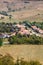 Vertical shot of town center with buildings, streets, and vegetation in Rupea, Romania