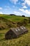 Vertical shot of traditional Scottish stone cottage houses near the northern coast of Scotland