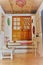 Vertical shot of a trendy rusty interior with wooden windows and a door