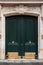 Vertical shot of typical doors in the daylight in Paris, France