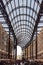 Vertical shot of unidentified people walking and shopping in Hay\'s Galleria in London