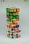 Vertical shot of unsolved Rubik\\\'s Cube on a white background