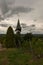 Vertical shot of vineyards next to a church