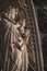 Vertical shot of the Virgin of Paris sculpture and the facade of the Cologne Cathedral, Germany