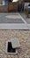 Vertical shot of a water manhole on a gravel yard