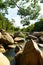 Vertical shot of water in the middle of rocks at Ba Ho Waterfalls Cliff in Vietnam