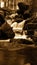 Vertical shot of waterfalls over rocks with long exposure in sepia