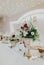 Vertical shot of wedding table decorations with beautiful floral compositions