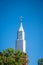 Vertical shot of the white tower of St Joseph's Roman Catholic Church, Australia against sunny sky