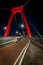 Vertical shot of the Willemsbrug or Williams Bridge in Rotterdam, Netherlands at night