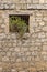Vertical shot of a window on Uruena wall, Valladolid, Castilla y Leon