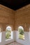 Vertical shot of the windows of the Alhambra Palace in Granada, Spain