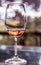 Vertical shot of a wineglass with some rose wine