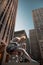 A vertical shot of a woman-shaped balloon in front of  Rockefeller Center, NYC, NY