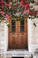 Vertical shot of a wooden door of a beautiful building in Naxos, Greece