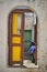 Vertical shot of a wooden door in Symi greek island