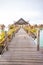 Vertical shot of a wooden path to the overwater  bungalows in Kapalai Resort in Malaysia