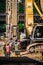 Vertical shot of workers working on a construction site project building