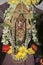 Vertical shot of worship of Goddess of wealth Lakshmi richly decorated