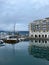 Vertical shot of yachts in the port with apartments in the background, Tivat, Montenegro