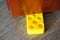 Vertical shot of a yellow cheese shape door blocker