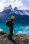 Vertical shot of a young male hiker in Torres del Paine National Park, Magallanes region, Chile