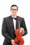 Vertical shot of a young musician posing with a violin