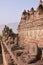 Vertical side View of a row of statues without head at Borobudur