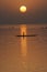 Vertical silhouette of canoes on Niger River