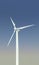 Vertical size. Clean natural alternative energy. Wind turbine at blue sky