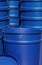 Vertical snapshot of large blue buckets.