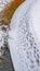 Vertical Snowy trail along Oquirrh Lake with track marks