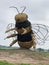 Vertical of Snugburys Ice Cream's bumblebee sculpture in Nantwich, Cheshire, England, UK