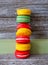 Vertical stack of multi colored French macrons
