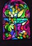 Vertical stained glass window with abstract background of multicolored glass with plant and fruit ornaments