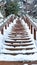 Vertical Stairway on a scenic nature and residential landscape with white snow in winter