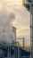 Vertical Steam emitted from the smokestack of a Power Plant in Utah Valley at sunset