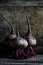 Vertical still life photography of three beetroots - perfect for an article about agriculture