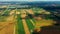 Vertical stripes of agricultural parcels of different crops. Aerial view shoot from drone directly above field